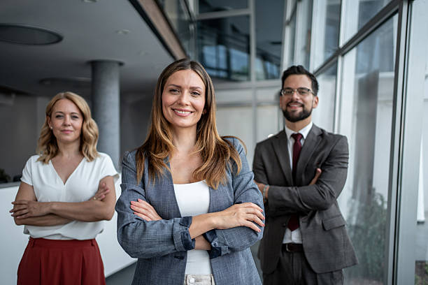 istock Confident business team smiling with arms crossed in office 2225555885