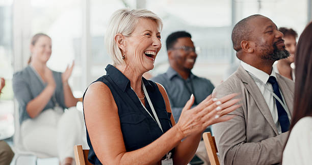 istock Conference, applause and business people with achievement, smile and feedback with support. Audience, laughing or group in workplace, clapping or success with thank you, humor or event with cheering 2225556776