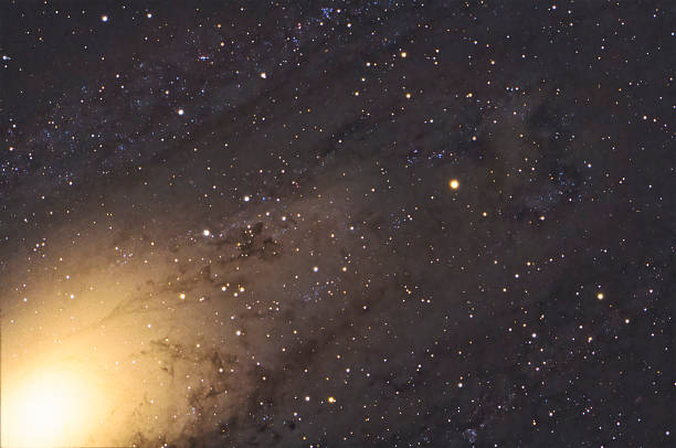 Close-up view of the Andromeda Galaxy (Messier 31), the dark bands are formed by dust that obscures the light of billions of stars
