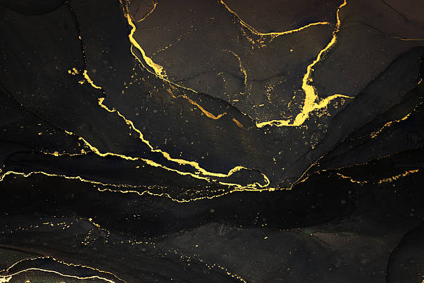 istock Abstarct fluid ink background with black and golden splashes 2225560576