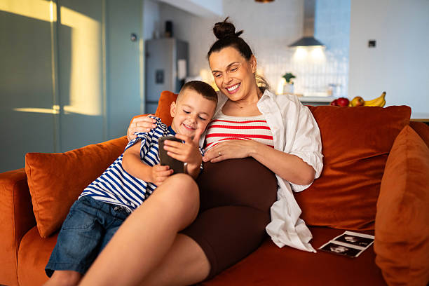 istock My son is so happy while waiting for his baby sister 2225561646