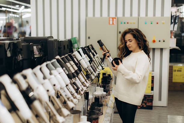 istock Woman Shopping for Electronics in a Retail Store 2225564384