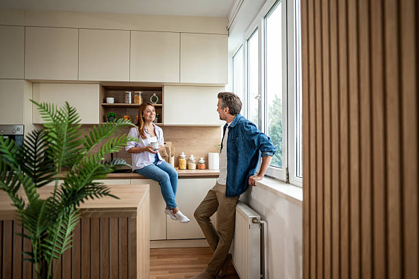istock Happy couple enjoying a relaxing morning in their modern kitchen 2225567854