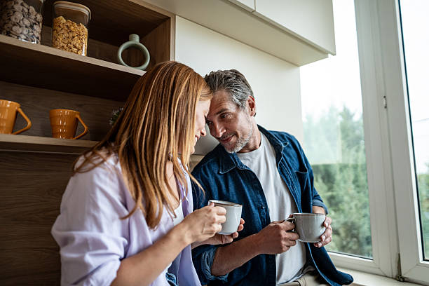 istock Couple enjoying a quiet moment with coffee in their kitchen 2225567884