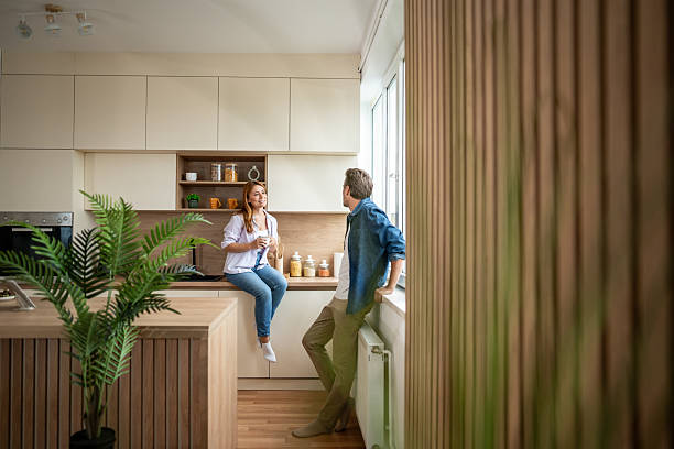 istock Couple enjoying morning coffee and conversation in modern kitchen 2225568064