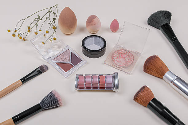 istock Makeup set with brushes, palettes, and sponges on a light background. 2225568546