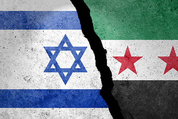 istock Israel and Syria flags on a concrete wall. 2225569684