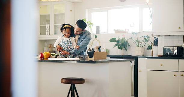 istock Vegetables, cooking and dad with child in kitchen learning for lunch, dinner and meal prep. Family, food and father teaching girl with ingredients for healthy eating, wellness and nutrition in home 2225572387