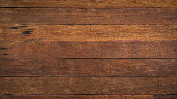 istock Dark brown wood texture as background 2225572444