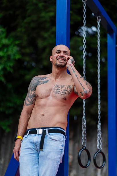 istock Man rests after finishing his calisthenics routine in the park 2225573107