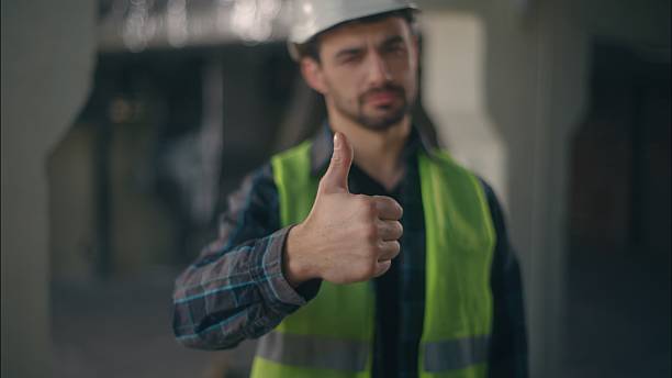 istock Satisfied Caucasian guy demonstrating thumb up in construction workman supervisor approve builder man positive successful sign male architect agreement electrician supporting feedback inspector work 2225578248