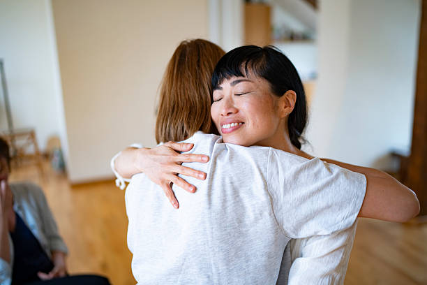 istock Two women embracing each other during therapy session 2225579071