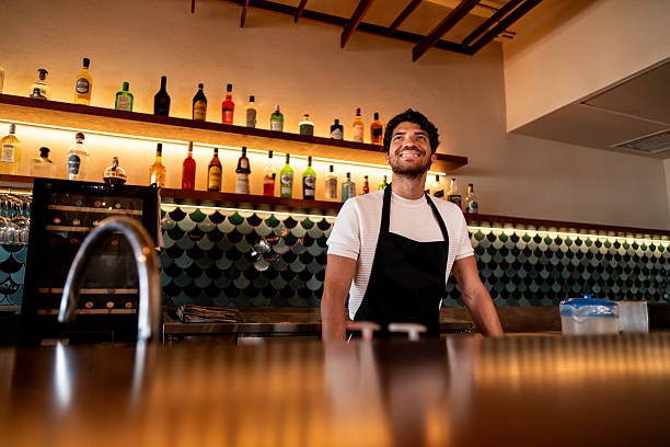 istock Young waiter contemplating at coffee shop 2225583186