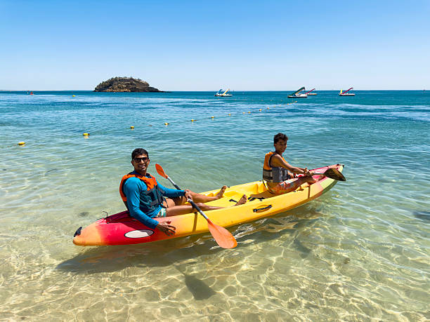 istock Tourists kayaking on the beach 2225587117
