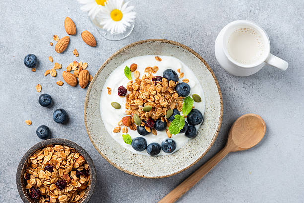 istock Greek yogurt bowl with crunchy granola and blueberries 2225587736