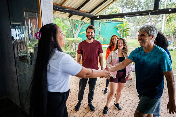 istock Friends greeting a receptionist at hotel 2225588167