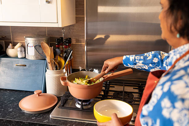 istock Mother Frying Vegetables 2225593650