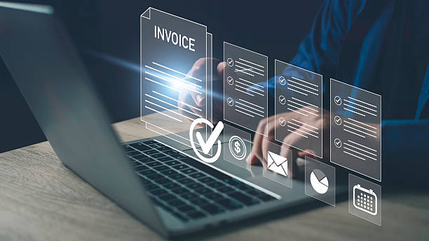 istock Hand using laptop with digital invoice and checklist icons, representing e-invoice, online billing, digital finance management, payment automation, and electronic business documents. 2225595746