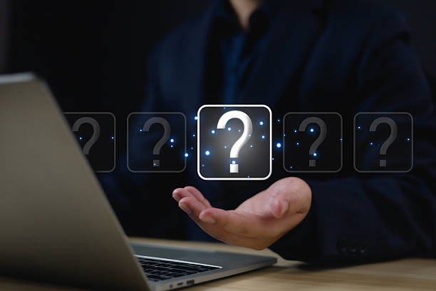istock Question mark shows on a palm, Businessman show question mark icon, Technology question concept, FAQ, Wondering questioning and problem-solving, Q and A, ask 2225595870