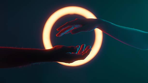 Symbolic Connection of Two Hands Under Neon Light