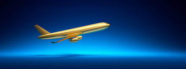 istock Golden Plane toy model on dark blue backdrop 2225596841