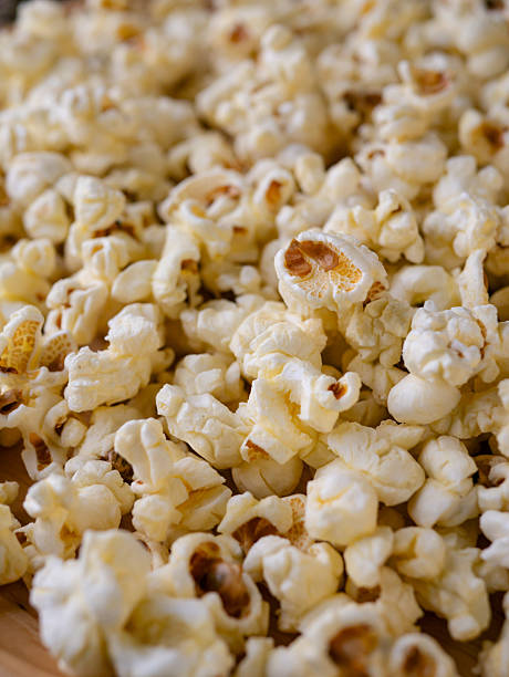 istock Butter salted popcorn on wooden table. 2225597069