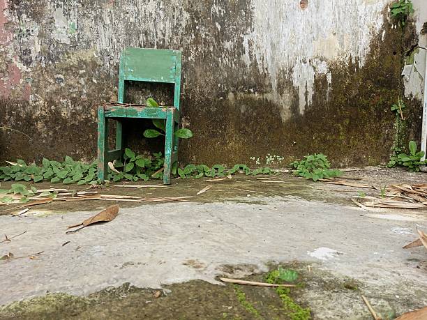 Interior of old factory buildings destroyed. Ruins of industrial enterprise, dark debris destroyed factory premises in factory as result of economic crisis and earthquake.