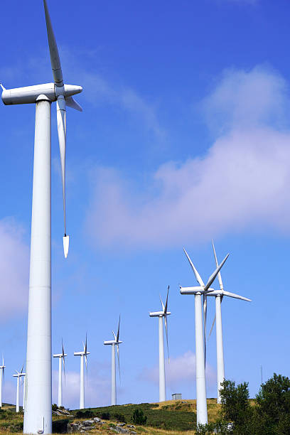 istock Vertical Image of Windmills on a Hill Under a Clear Blue Sky 2225598731