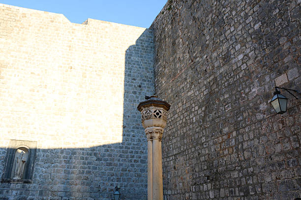 Dubrovnik, Croatia - June 26, 2017 - Orlando Column, a stone column, deep carved in the form of an ancient knight on Luza square