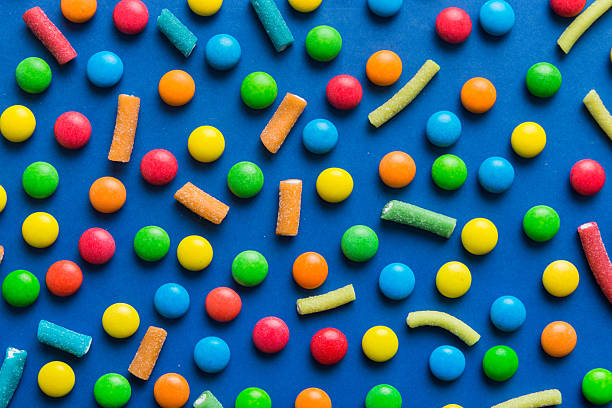colorful candies as background top view. Seamless pattern with candy. Many sweet candies close-up.