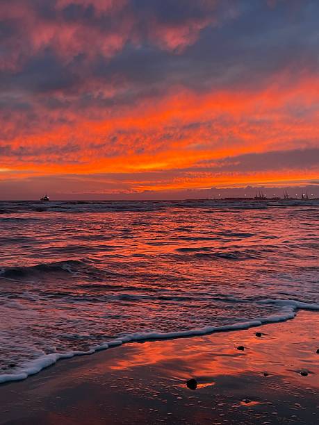 istock Pink sunset over the sea with gentle waves 2225605277