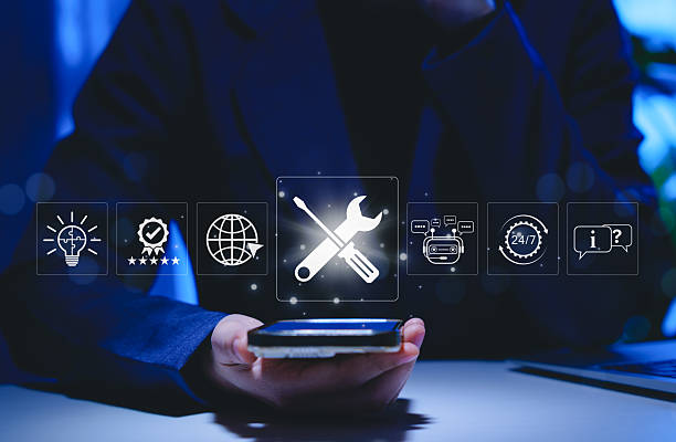 istock Technical support and customer service concept. Person using smartphone with icons representing technical support, AI chatbot, 24/7 service, solutions for global support, and customer assistance tools 2225606870