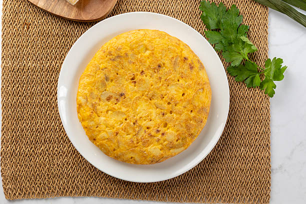 istock Spanish omelette, a traditional dish served on a white plate 2225606924