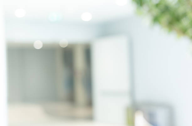 istock Abstract blurred workplace interior with modern glass window reflective background ; loft style contemporary design of lounge or lobby for presentation and design as banner and ads 2225608943