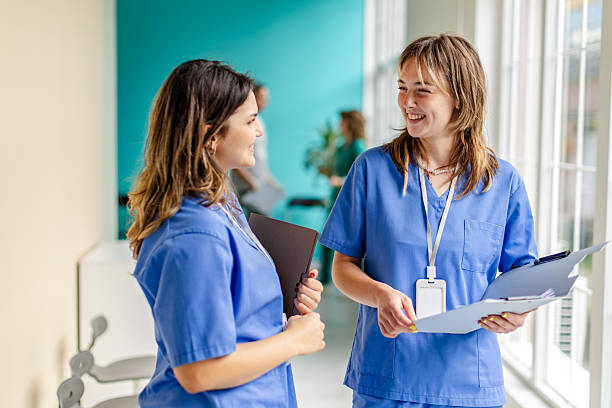 istock Nurses engaged in conversation and collaboration in a hospital environment 2225609098