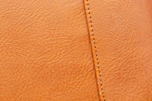 istock Brown macro synthetic leather texture,plastic, artificial plastic material that looks colorful,Brown macro synthetic leather,Synthetic leather brown background texture. Brown leather textured background. 2225609254