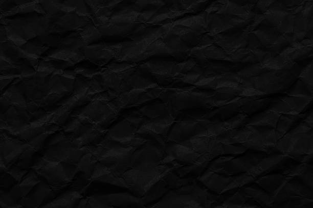 istock Macro crumpled paper texture,Macro black crumpled paper textur. 2225609273