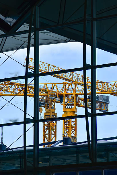 istock Crane truck working in construction site with sky background. Crane against sky. 2225609478