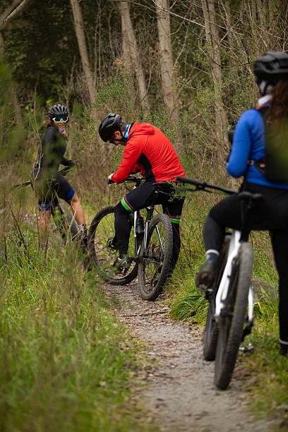 istock Three friends cycling for a ride in the woods 2225611331