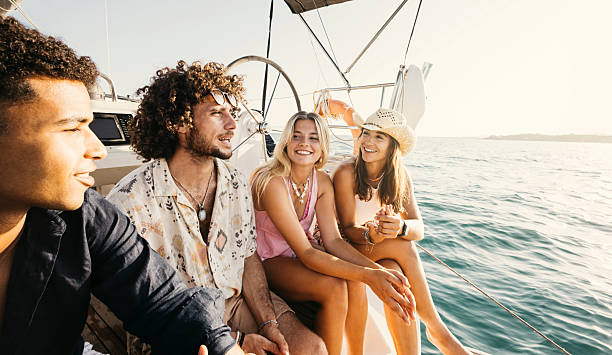 istock Young tourists enjoying a sailboat excursion on summer vacation 2225613568