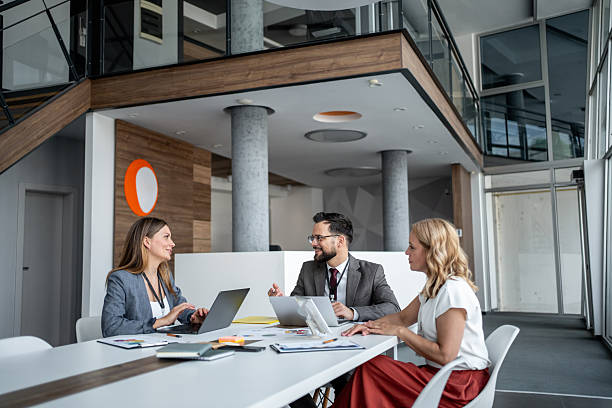 istock Business team having a meeting using laptops in modern office 2225617345