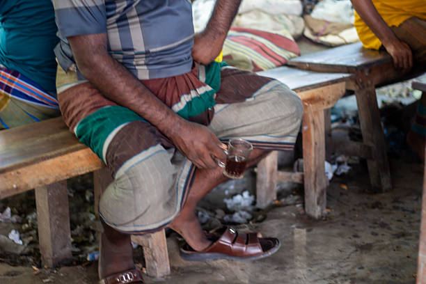Cap-Haitien, Haiti - February 4th, 2010 : A Haitian man sits on a side of the street, after being rendered homeless by the earthquake that destroyed his house and millions of other structures and lives in Haiti.