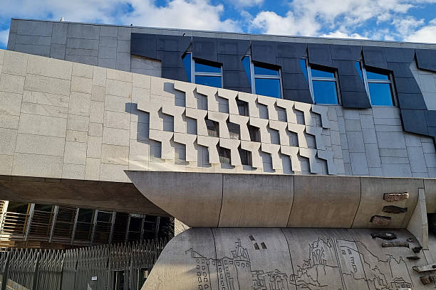 Edinburgh, UK - May 3, 2025: Scottish Parliament building entrance and sign in Holyrood, Edinburgh, Scotland.