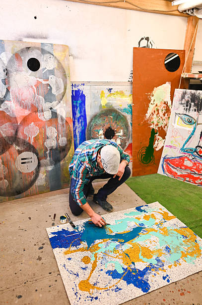 istock Artist painting abstract modern art on canvas in studio 2225618555