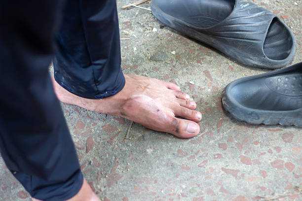 istock A boy is standing with his feet on the ground 2225619850