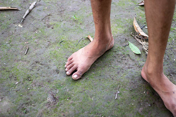 istock A boy is standing with two feet on the ground 2225620093