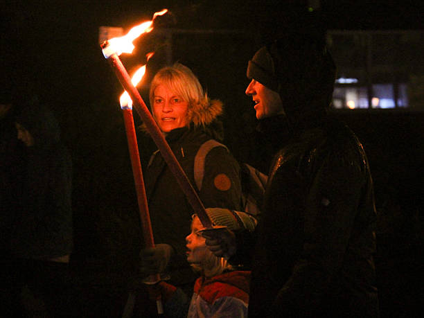 Traditional event in Cranleigh, Surrey.  Guy Fawkes Bonfire night, a fire torch parade and bonfire event, November 4th 2024