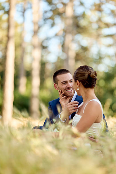 Romantic Couple Enjoying Intimate Moment Outdoors in a Beautiful Forest Setting
