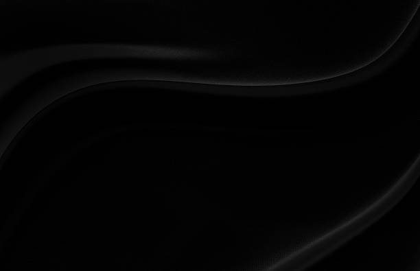 istock Black gray satin dark fabric texture luxurious shiny that is abstract silk cloth background with patterns soft waves blur beautiful. 2225624614