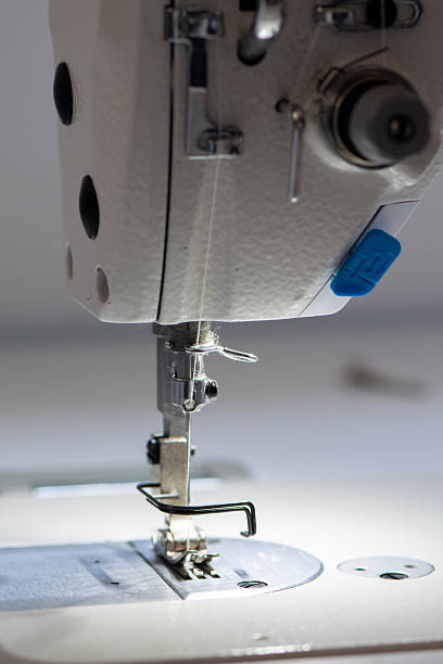 istock Industrial Sewing Machine and Precision Needle Mechanism in Tailor Workshop 2225625197